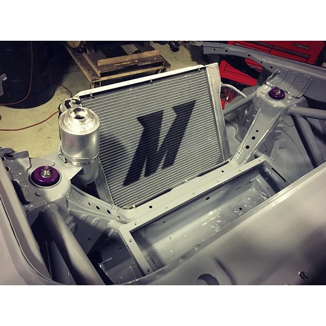Custom rear mounted @mishimoto dual pass radiator going into the #TTZ. @bwillkillperson whipped up this sweet swirl pot to help self bleed out any air bubbles in this extensive cooling system.