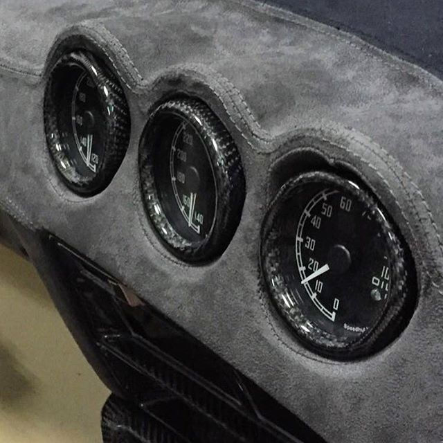 The guys at @carbonsignal have been hard at work restoring the interior on my Datsun over the last few months. Here's a sneak peak of some of the crafty work... Full Alcantara and carbon interior with custom gauges from @speedhut to match the style and font of the factory Datsun gauges. Can't wait to get it back to finish the installation!